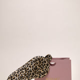 Leopard print silk eye mask next to a ROSEMO pink gift box 