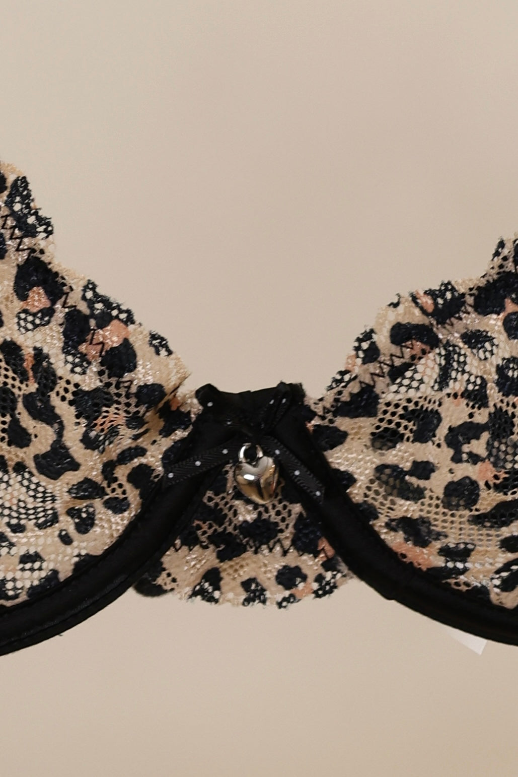 Leopard print bra on a beige background
