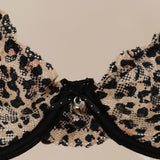 Leopard print bra on a beige background