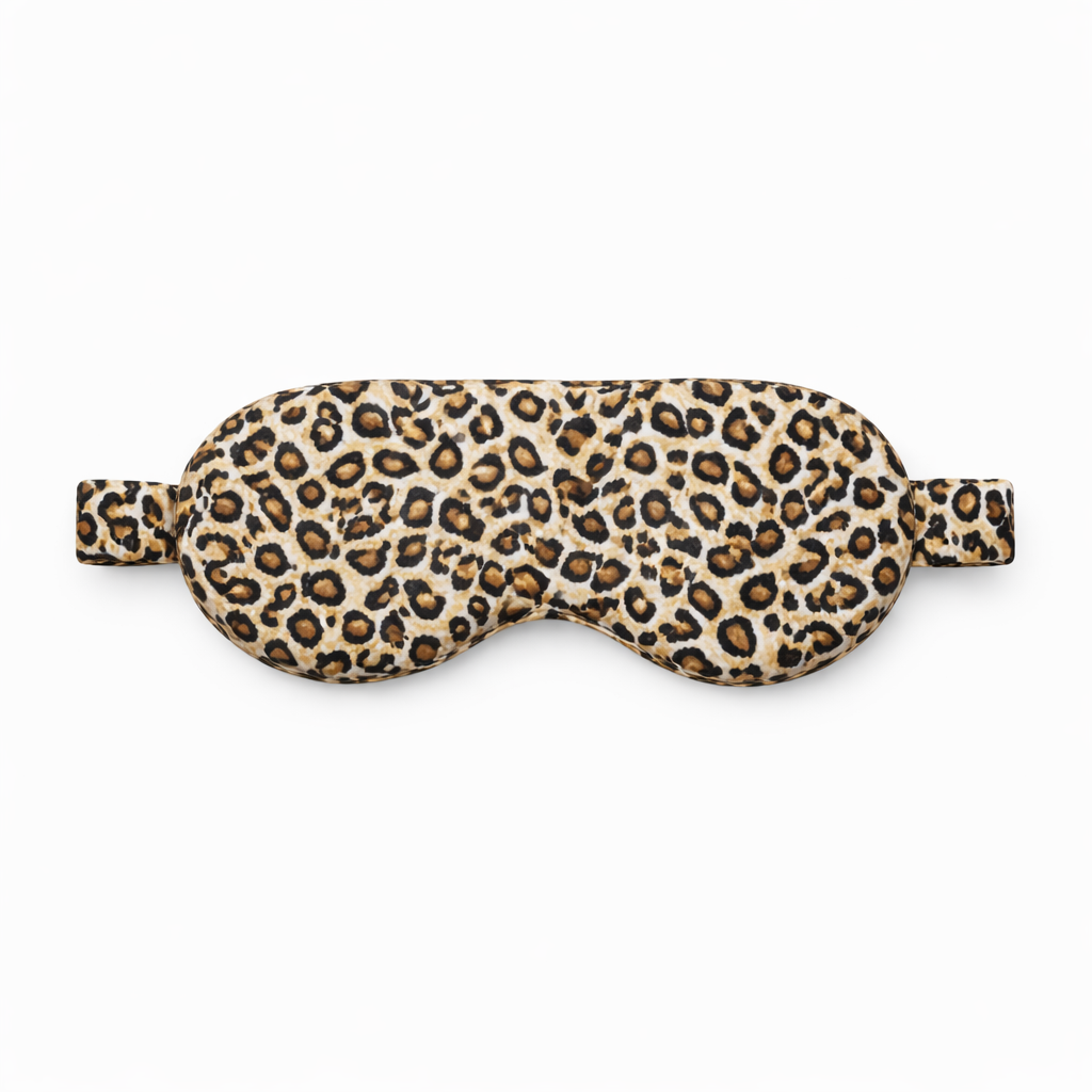 Leopard print silk sleep mask on a white background