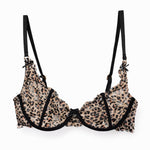 Leopard print lace bra with black bow straps on a white background