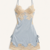 Light blue satin romantic nightgown with gold lace trim background