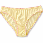 Yellow women's underwear with pink trim on a white background