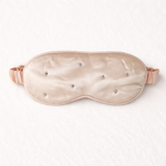 Silk sleep mask with rhinestone embellishments on a white background