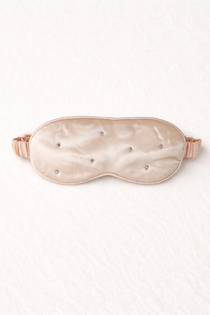 Silk sleep mask with rhinestone embellishments on a white background