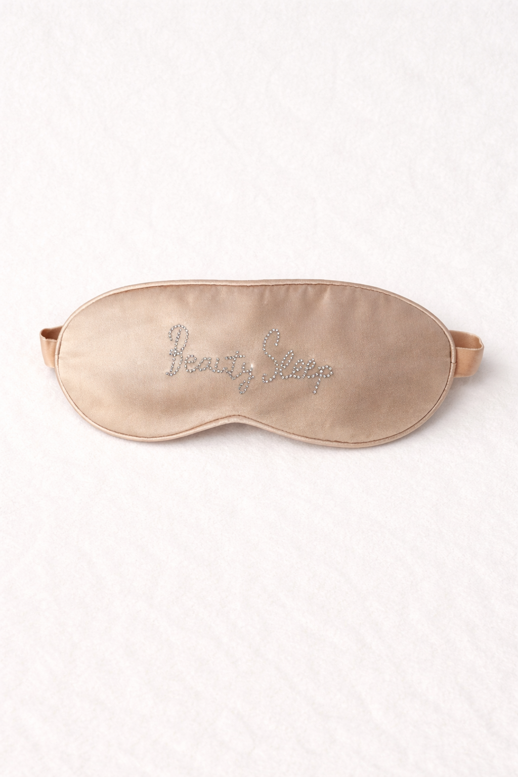 Silk sleep mask with rhinestone embellishments “beauty sleep”on a white background
