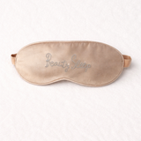 Silk sleep mask with rhinestone embellishments “beauty sleep”on a white background