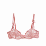 Pink lace bra on a white background